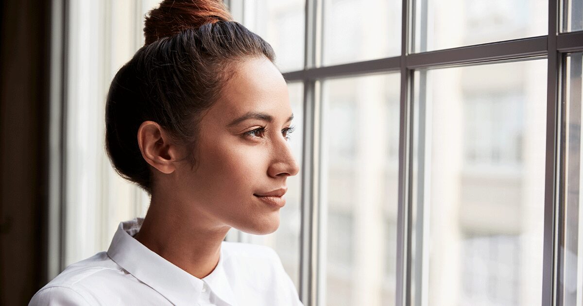A woman thinking about when she should take a pregnancy test
